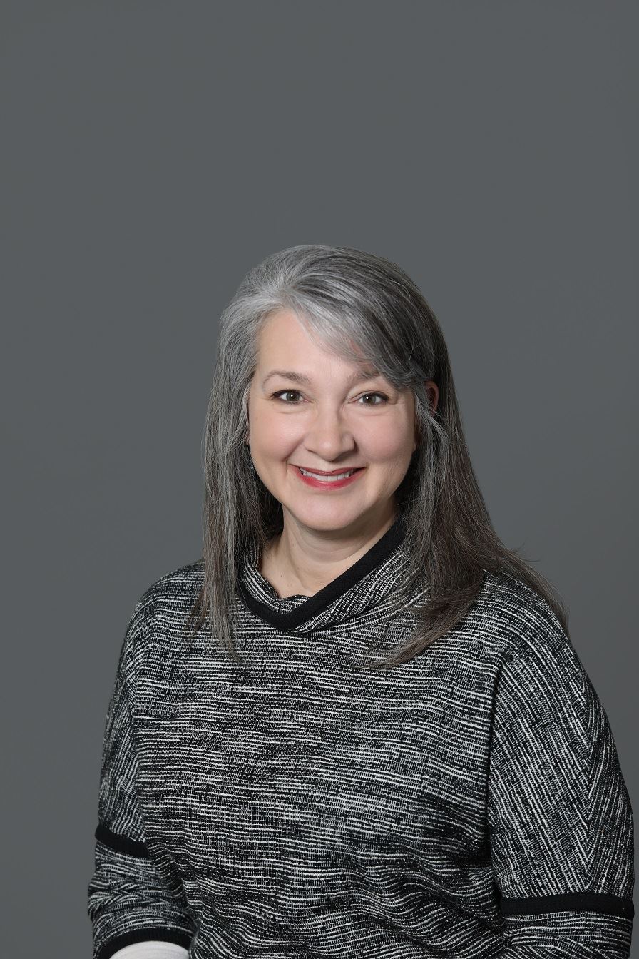 Barb Chidley, smiling for a headshot. 